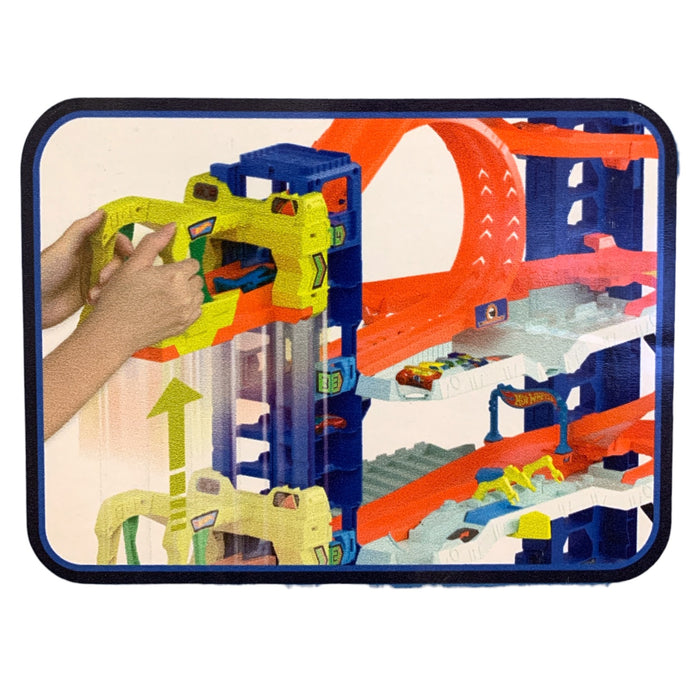 Hot Wheels City Ultimate Garage "Let's Race" Playset & 2 Cars, 50 Car Storage